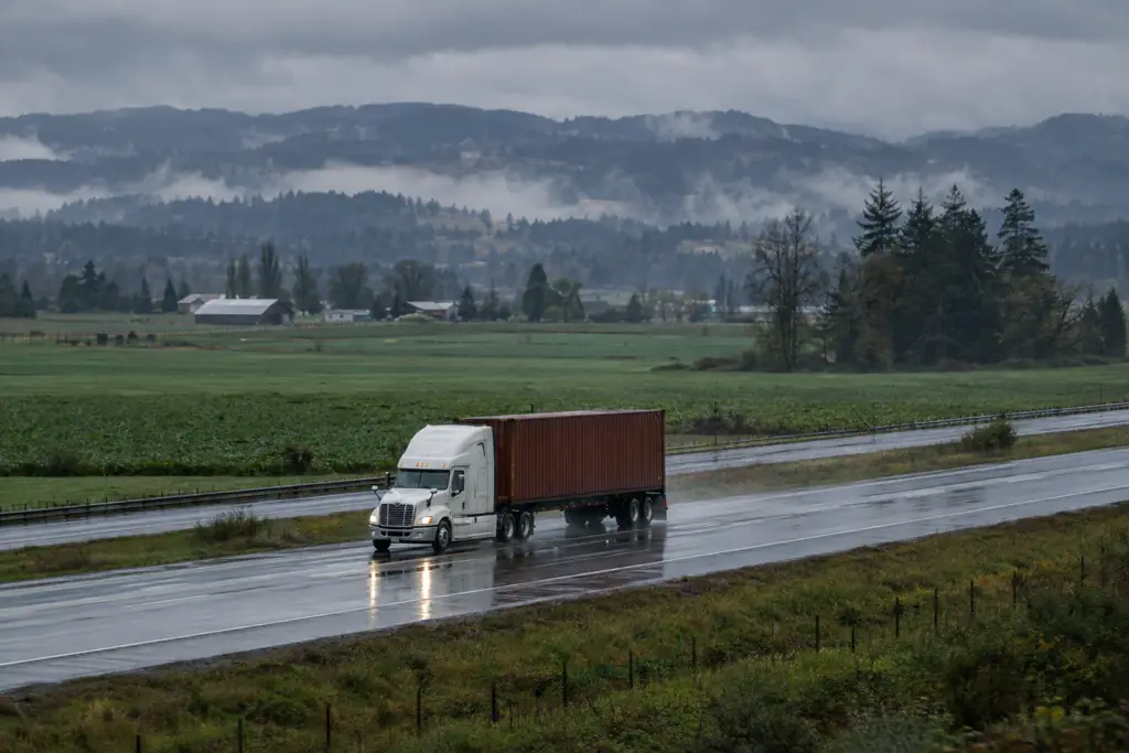 Truck hauling a shipping container on I-5 toward Lebanon
